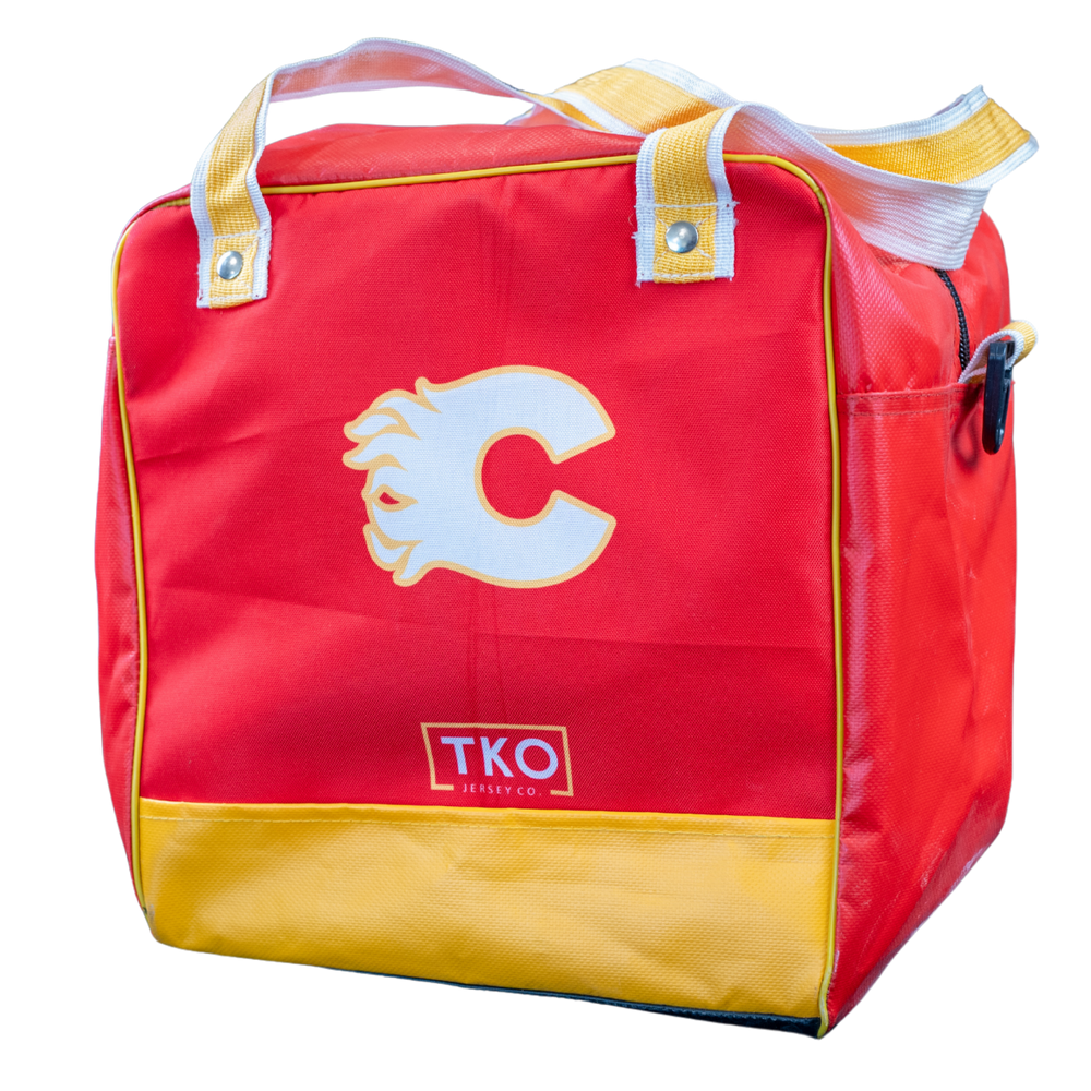 A red and yellow insulated bag with a large white 'C' logo on the front, a small 'TKO' logo near the bottom, and yellow-and-white handles, shown on a plain white background.